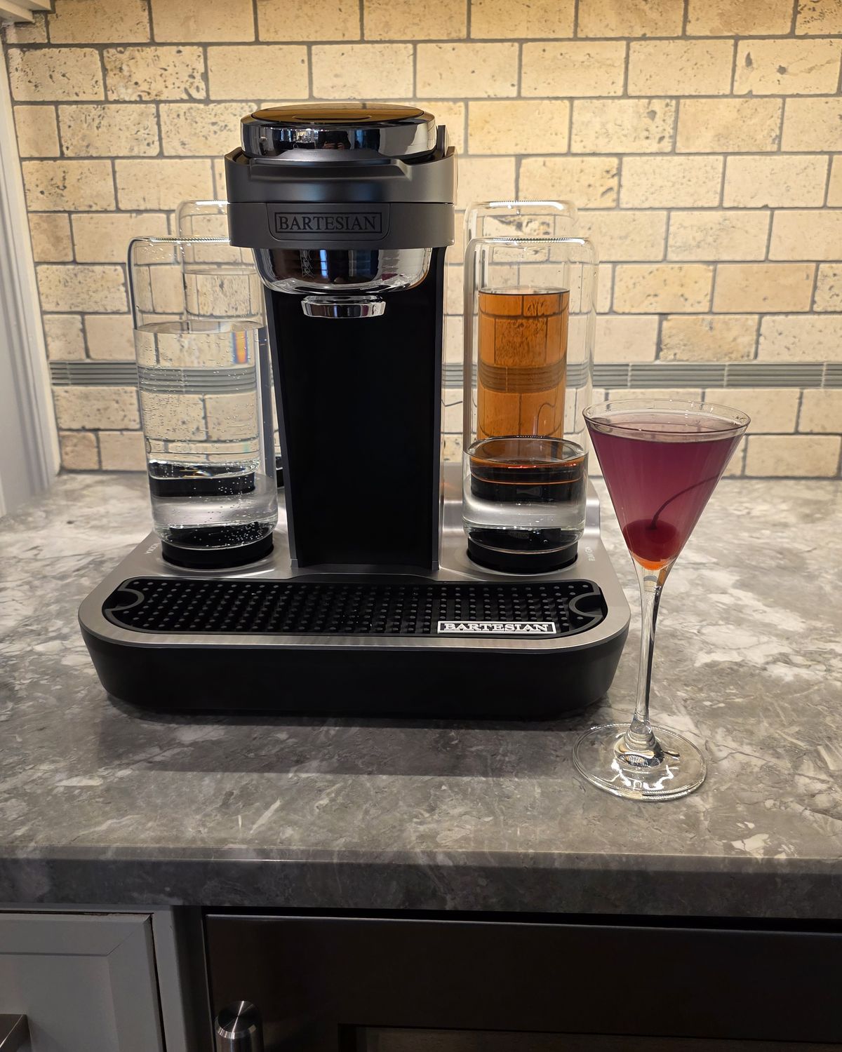 Bartesian Aviation pod cocktail in martini glass with stunning purple color from cr&egrave;me de violette