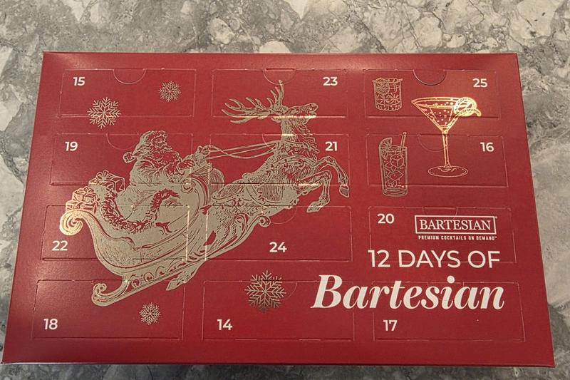 The Advent Calendar box seen from above, with its twelve doors numbered 14 to 25 in mixed order