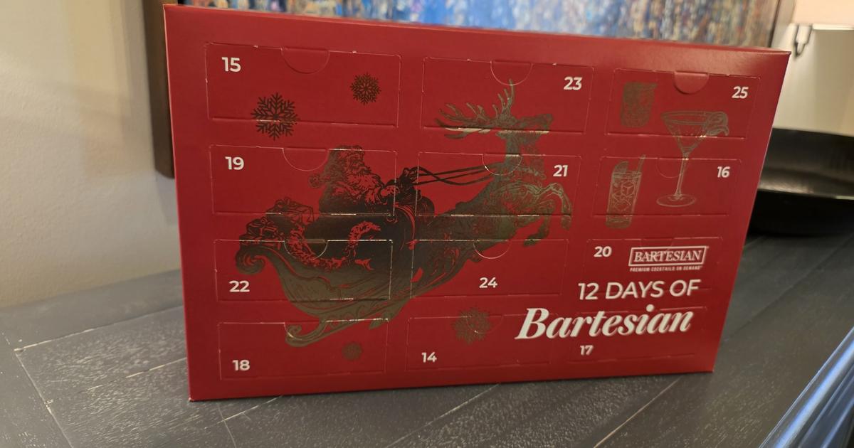 The red 12 Days of Bartesian Advent Calendar box standing on a dresser, its numbered doors showing