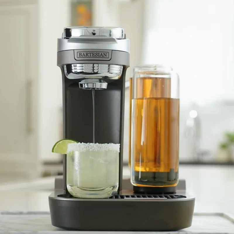 Bartesian Duet cocktail maker dispensing a margarita on a kitchen counter
