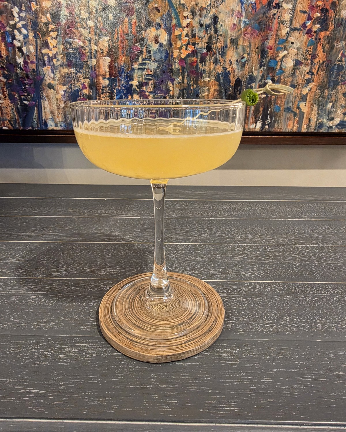 Bartesian Calamansi Daiquiri pod cocktail in a coupe glass with sunny yellow color and lime garnish