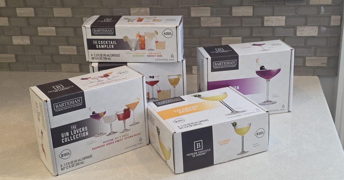 Boxes of Bartesian pods on a kitchen counter, including the Cocktail Sampler, the Gin Lovers Collection and Calamansi Daiquiri